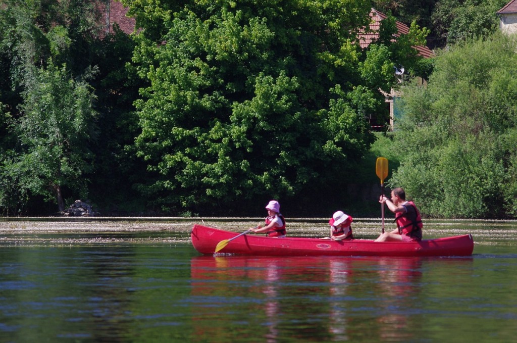 Canoeing on the river during a family holiday in the Dordogne